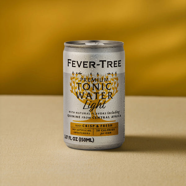 An 8-pack of Mother Root Fever Tree Light Premium Tonic [5.07 fl oz each] sits on a beige surface before a yellow background, with gold and black text plus decorative leaves around the brand name on each can.