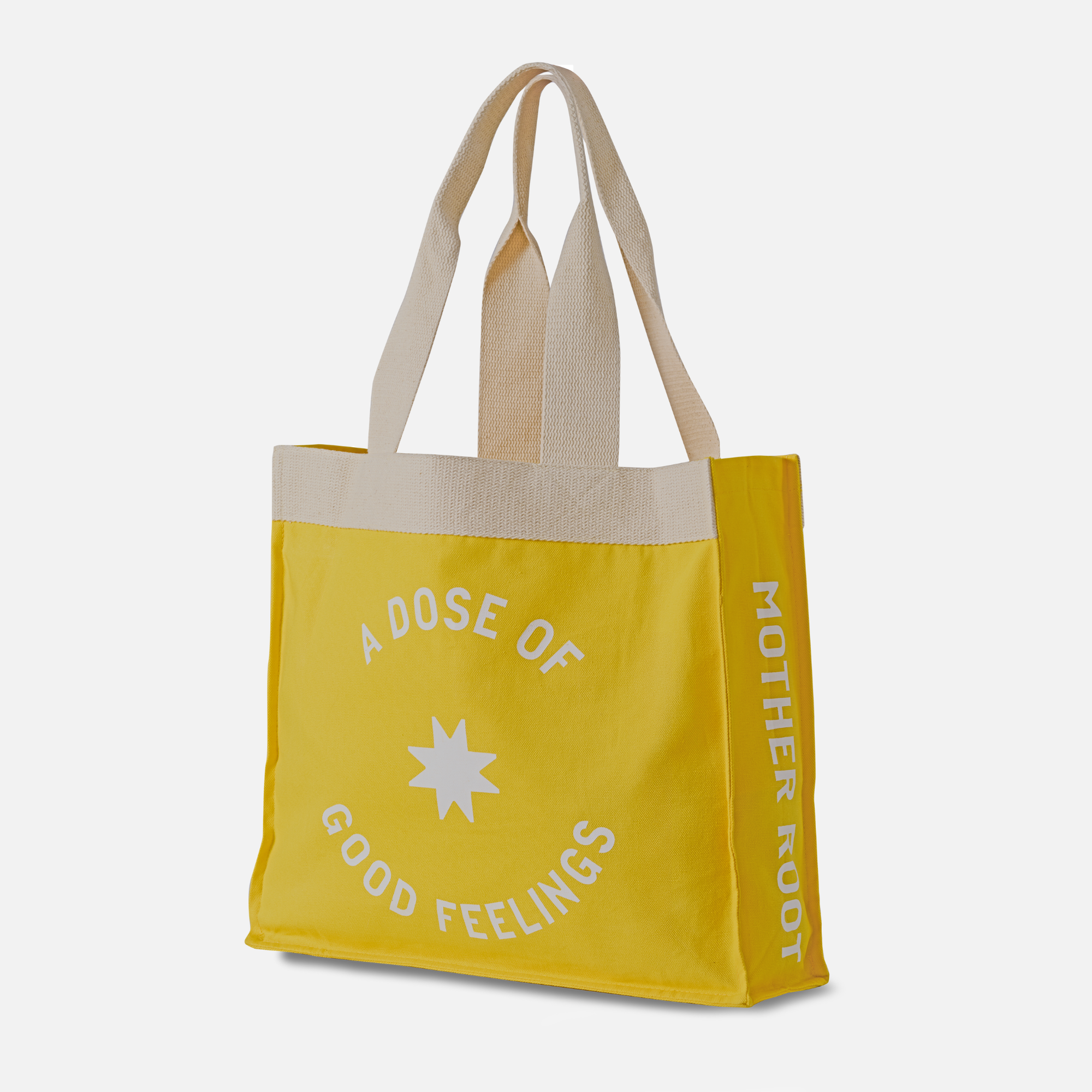 Yellow Mother Root Tote Bag with beige handles, side pockets, and white text; celebrates a sustainable initiative.